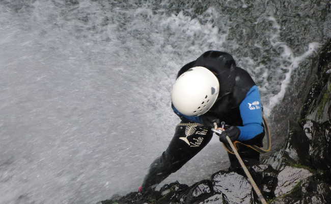 Abseiling while canyoning