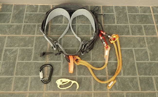 Climbing harness with lanyard